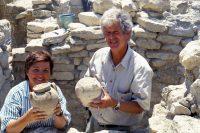 Joseph and Maria Shaw holding Minoan pottery recovered from a house at Kommos