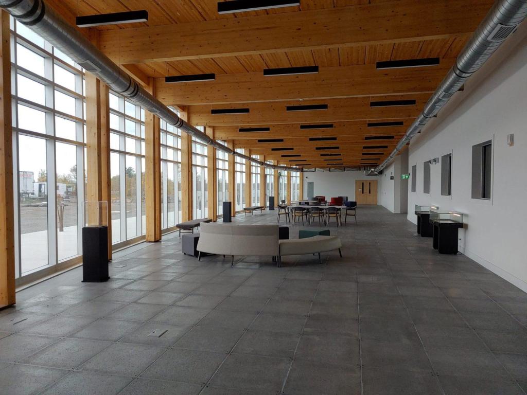 The interior of the Anishinaabek Discovery Centre makes use of natural wood tones and tall, sweeping windows. Photo: Sault Online