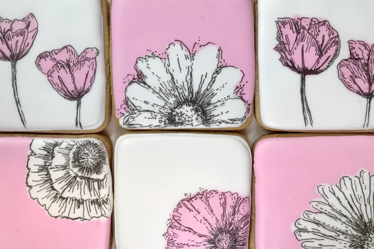 Pink and white cookies with flower deisgns
