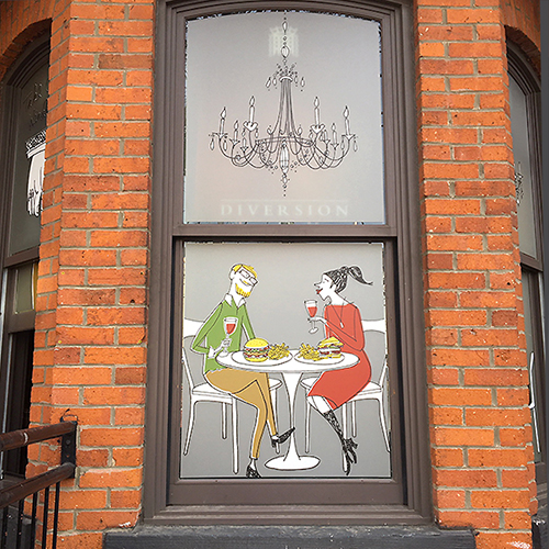 Window illustration of chandelier and two people sitting at a table and eating lunch with red wine.