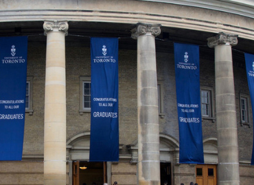 Banners reading Congratulatios to all our graduates hanging from Convocation Hall
