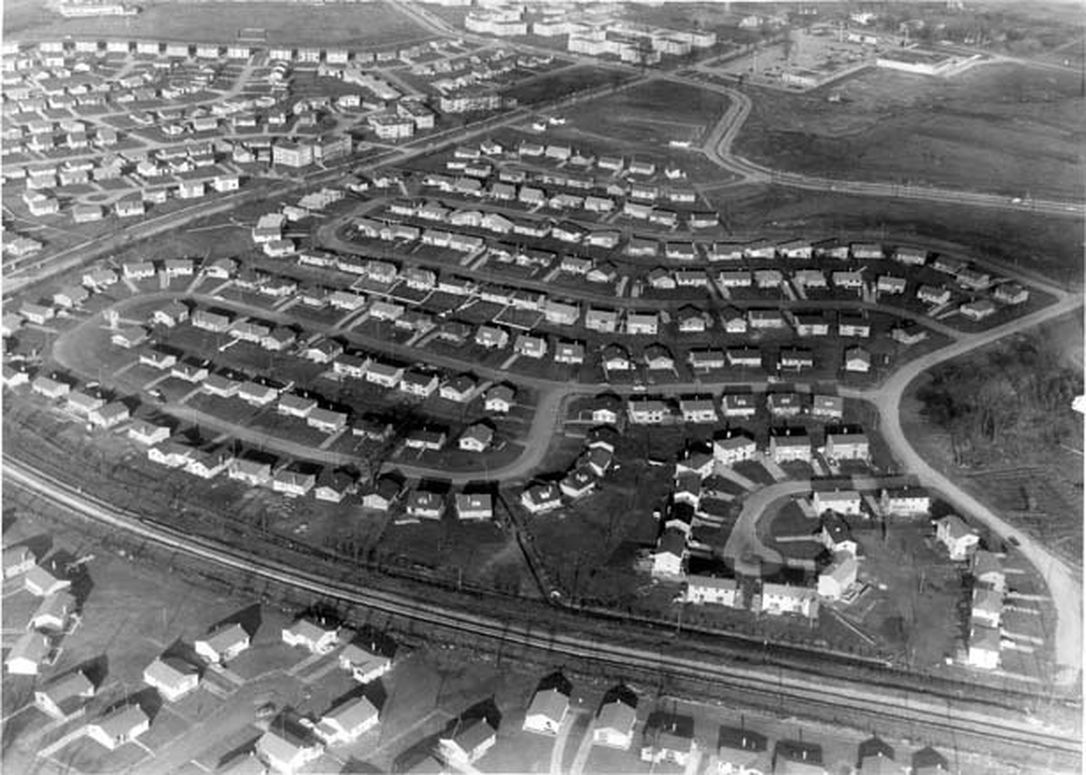 Aerial photograph of rows of houses and winding streets in Don Mills circa 1950